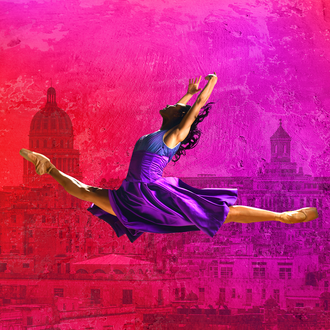 A dancer in a purple dress performs a split leap against a vibrant pink and red background with city buildings and domes.